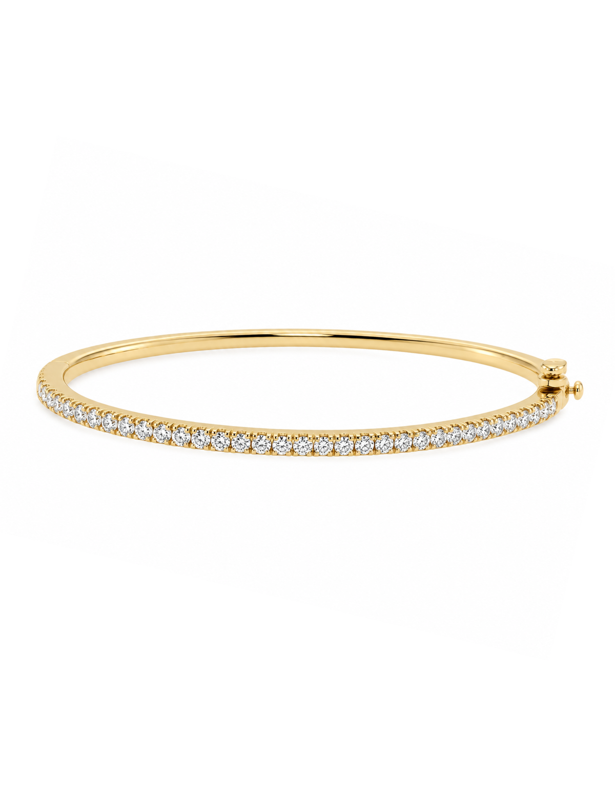 A thin yellow gold bangle bracelet with a single row of small clear pavé stones along the front, shown on a plain white background.