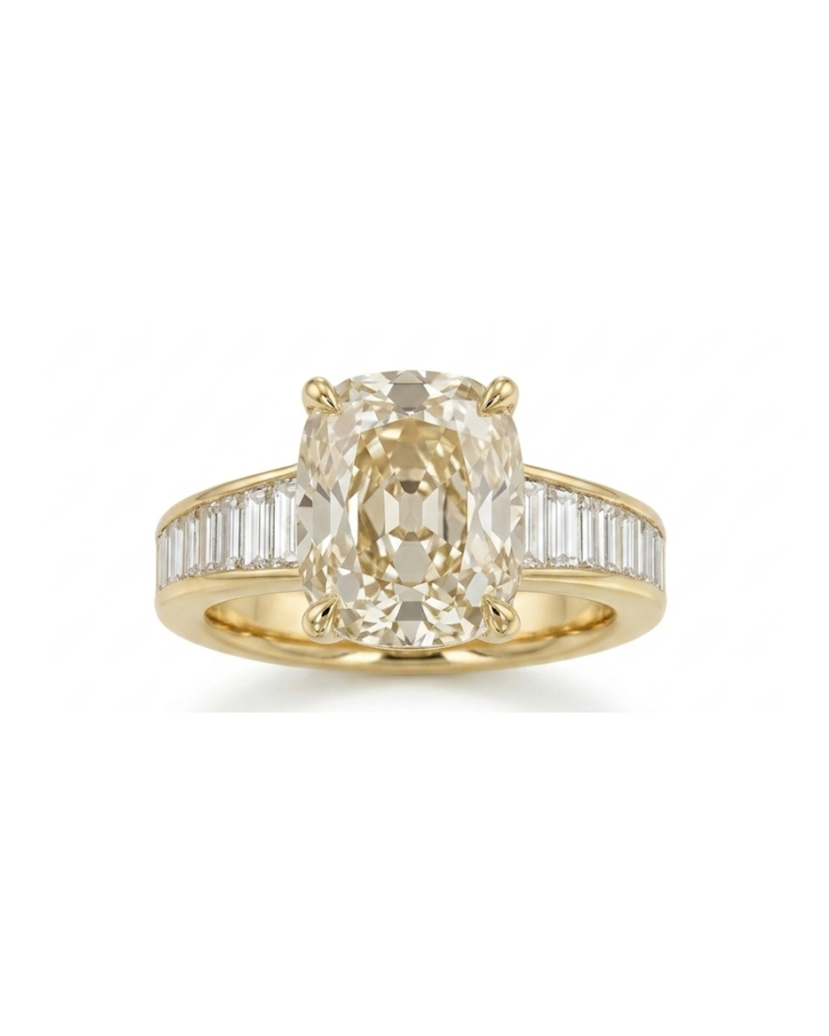 A yellow gold ring featuring a large oval-cut center stone and baguette side stones, shown on a plain white background.