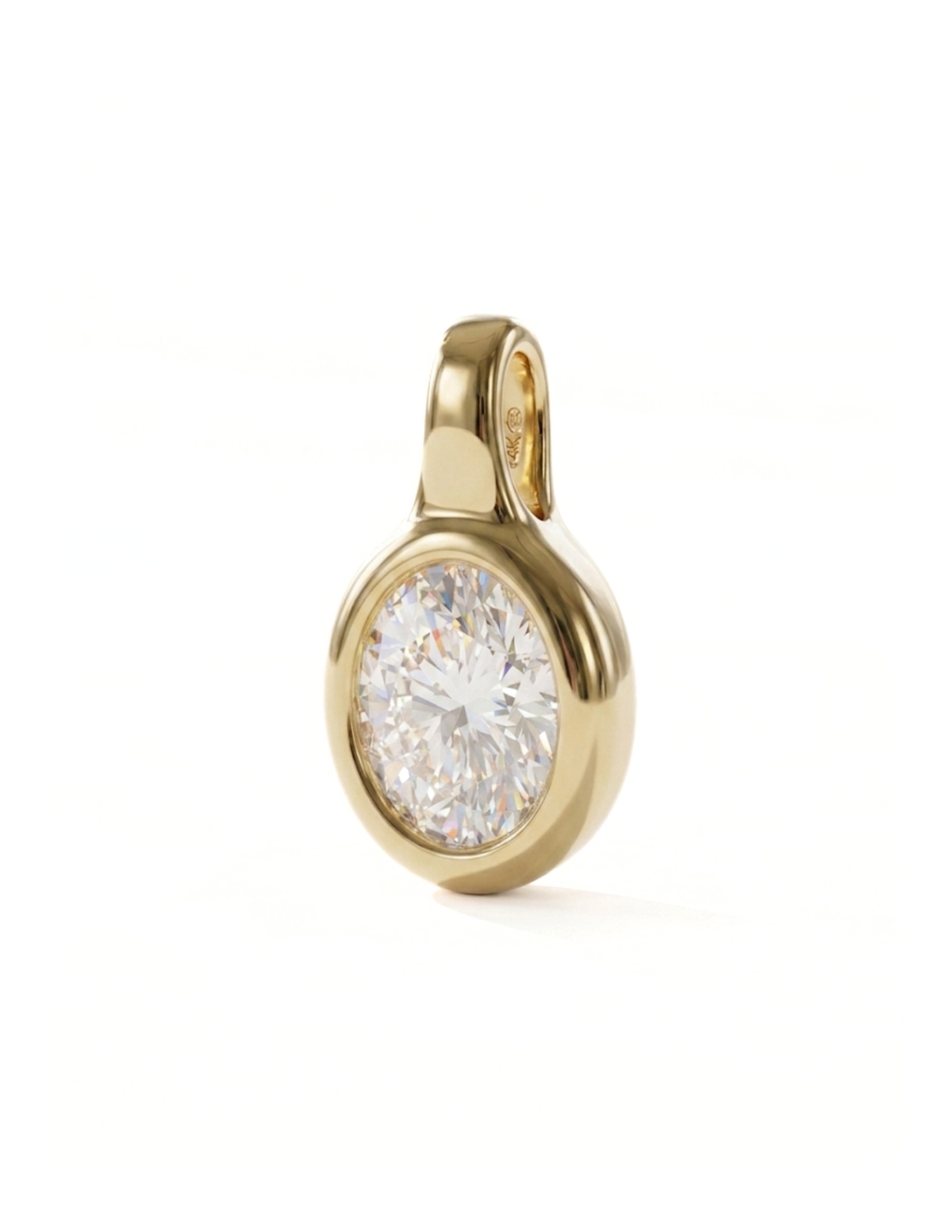 Gold pendant with a clear gemstone on a white background