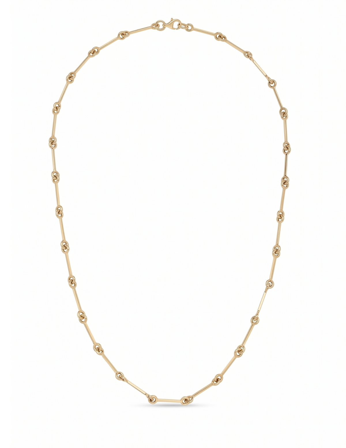 A delicate gold chain necklace with small, evenly spaced oval links, displayed in a clean, U-shaped arrangement on a solid white background.
