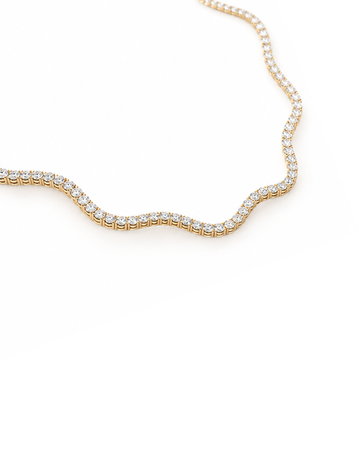 A close-up of a gold tennis necklace paved with small clear stones, shown against a plain white background.